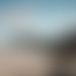 Person standing on a cliff, ready to leap, symbolizing courage and personal transformation