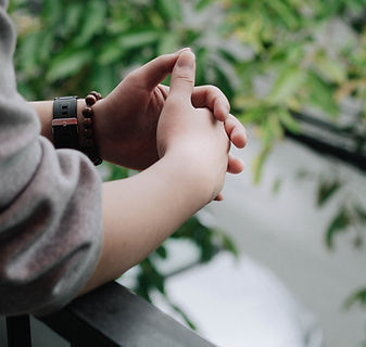 Hands clasped together