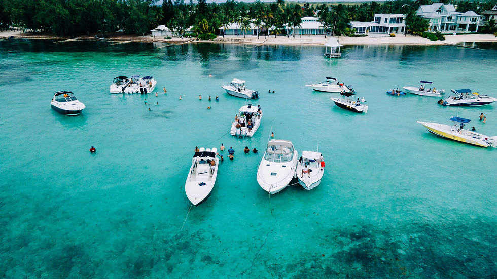 Boats in the water in the Cayman Islands - Strategic global relocation by Cloak & Daggerâ„¢