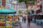 Bustling evening scene at Jalan Alor street, adorned with red lanterns and lively food stalls offering Vietnamese cuisine.