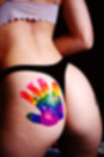 Woman with a LGBTQ sign on her back. Symbol for the free lesbian erotic story series "Emma's Awakening"