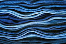 Stacked denim in various washes, Image by Michaela St