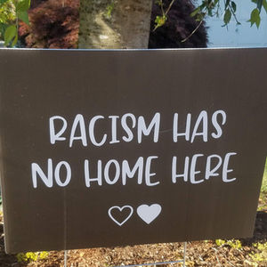 sign stating racism has no home here