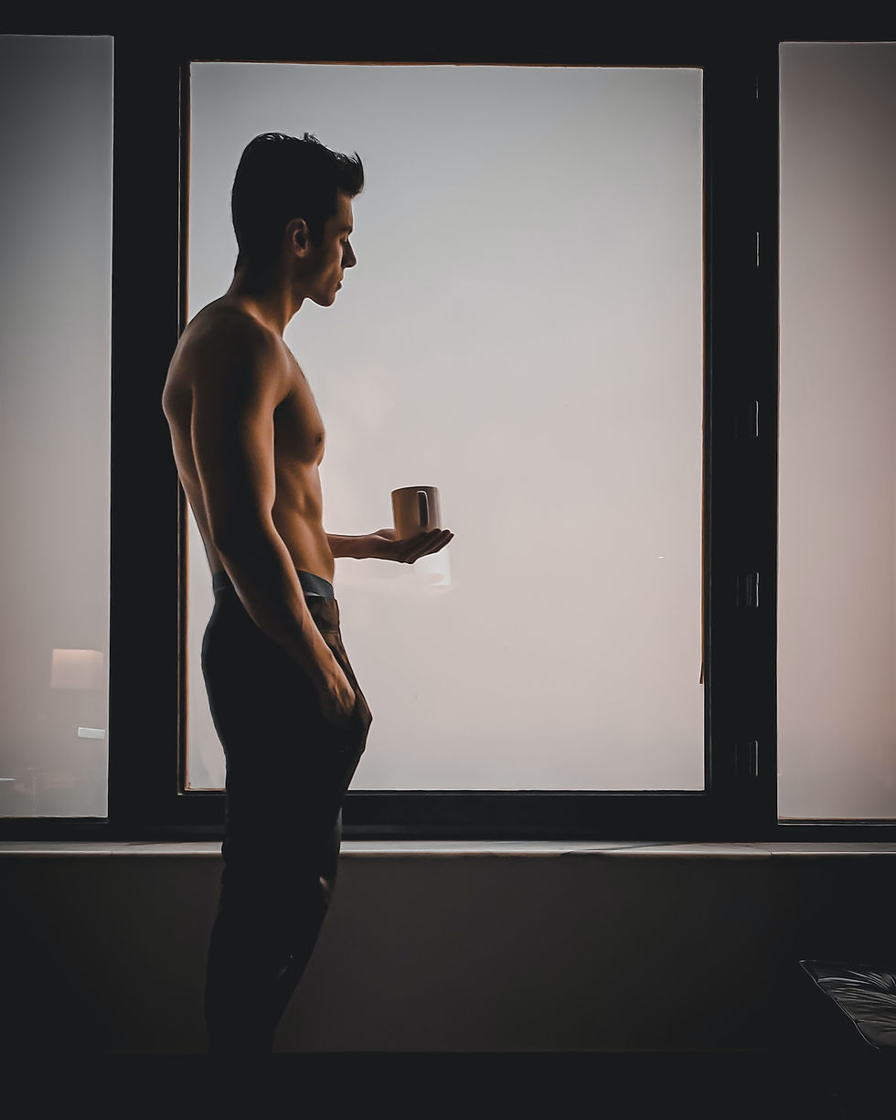 Picture of a sexy man bringing a cup of coffee used in a free gay sex story you can read online