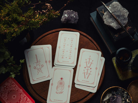 tarot cards spread in a table with crystals and plants
