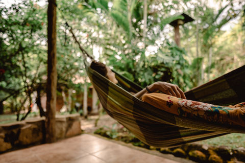 Lady relaxing in hammock on a day retreat, letting the wrold go by...
