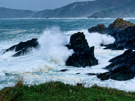 ocean waves beating against the rocks
