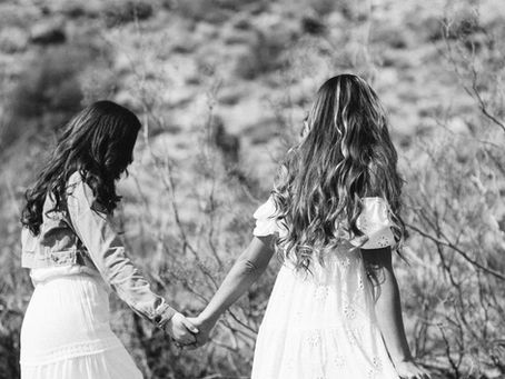 Two girls holding hands