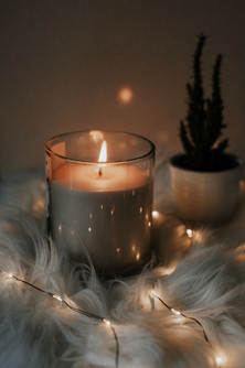 candles glowing in warm and fuzzy holiday setting