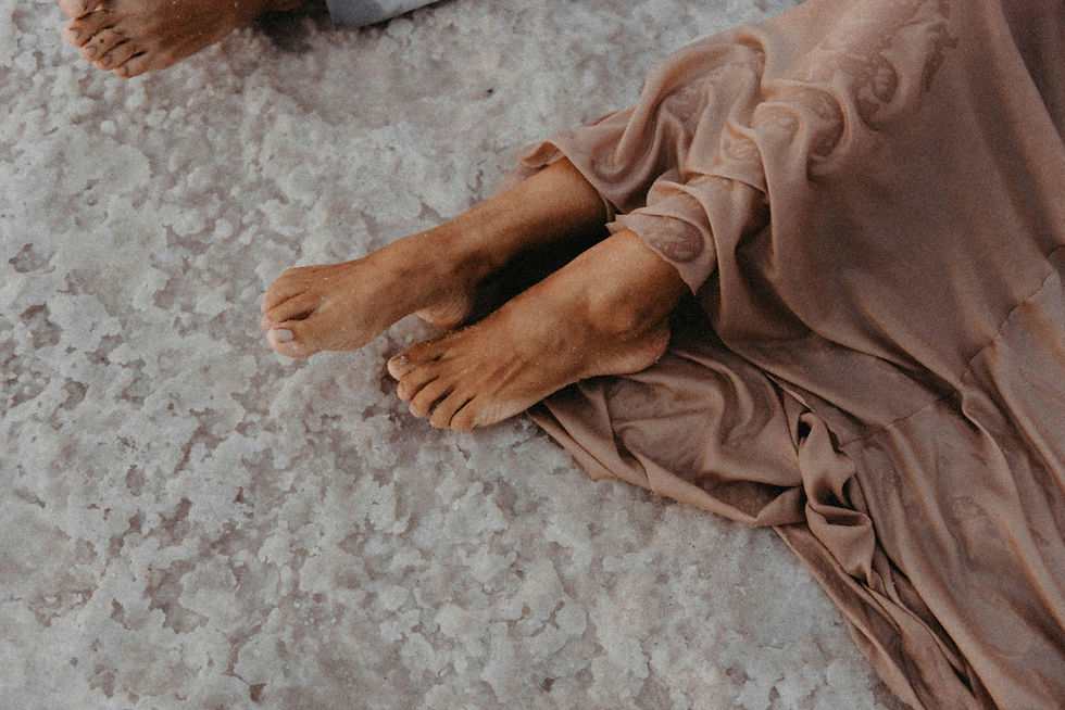 girl's feet on sand
