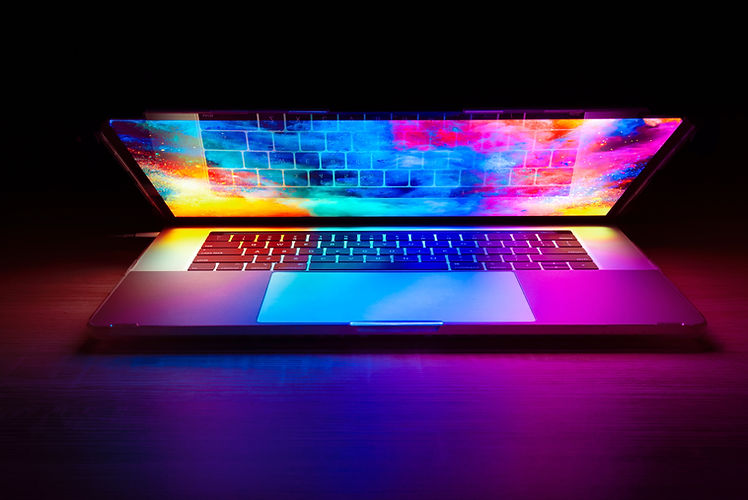 Laptop displaying colorful abstract design