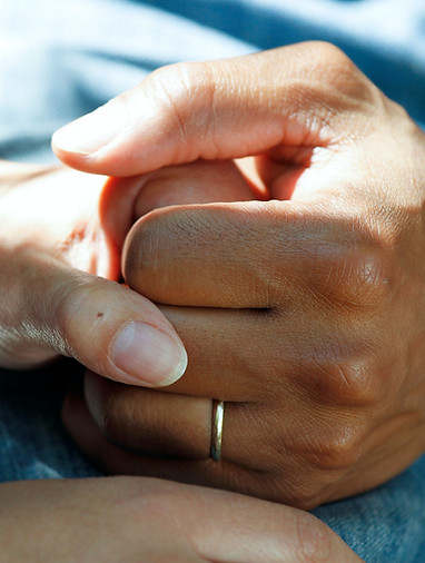 holding each other hands in support