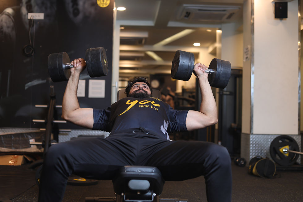 Strong man incline bench press heavy dumbbells without a spotter and dropping the weights after the set