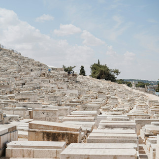 The ancient Jewish Cemetery on the Mount of Olives. Hundreds of white limestone tombs overlooking the Kidron Valley and the Temple Mount in Jerusalem.