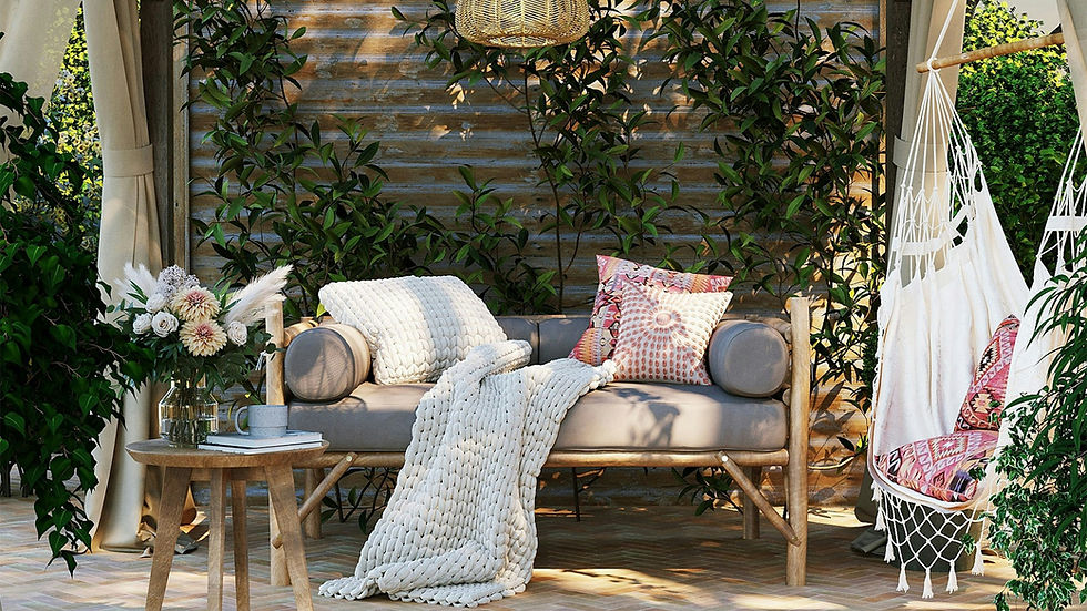 Cozy patio furnishing with greenery and a hammock chair and pillows and blanket.