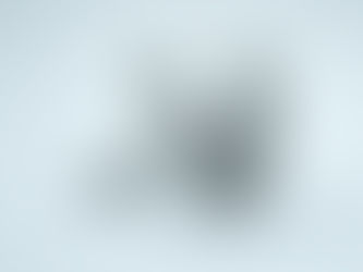 Gray humanoid figure sitting on a white background, holding a tablet displaying a similar figure. The image has a minimalist, neutral tone. It links to themes of identity and finding out who you are in Christ.