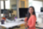 lady sitting at desk in front of computer