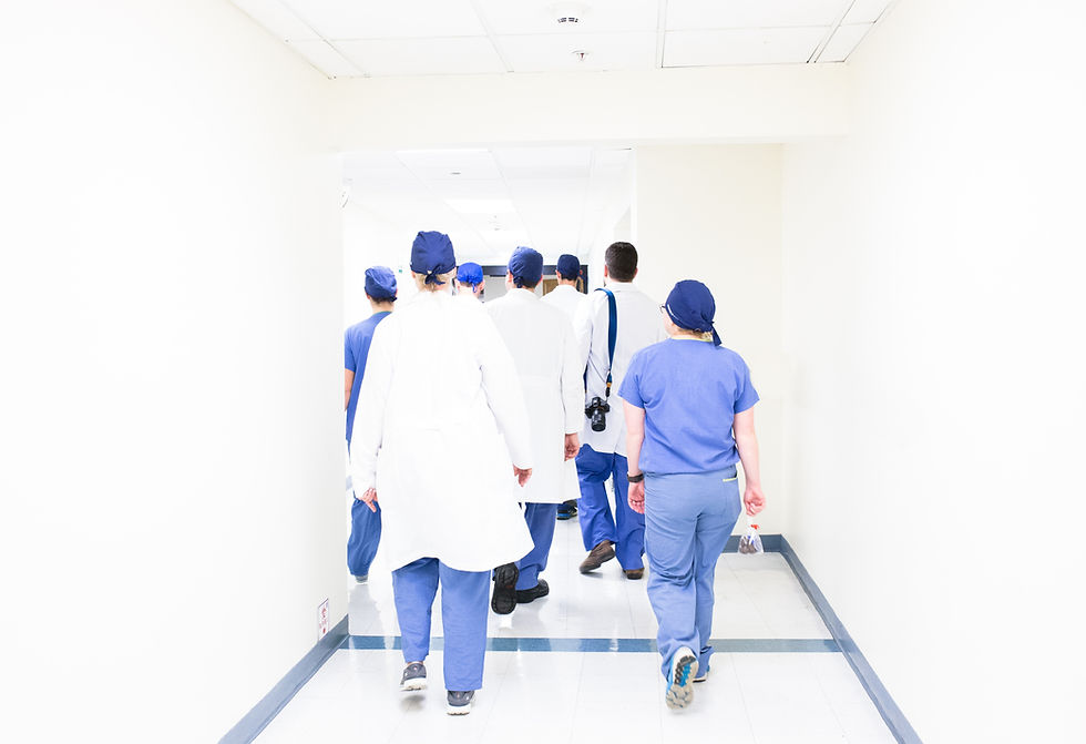 group of doctors walking away in a hall