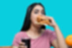 woman eating a fried chicken sandwich