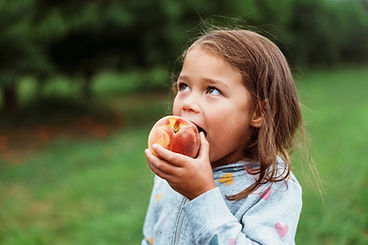 Girl eating apple.