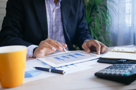 Chart comparing compilation vs review vs audit reports for small business Calgary Accounting