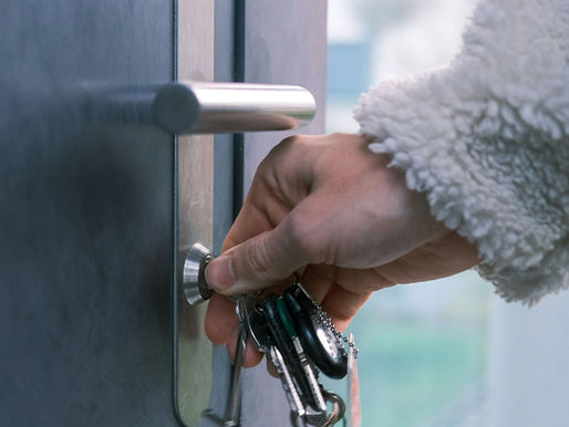 Woman unlocking door