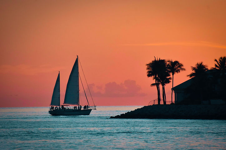 A boat on the water at sunset