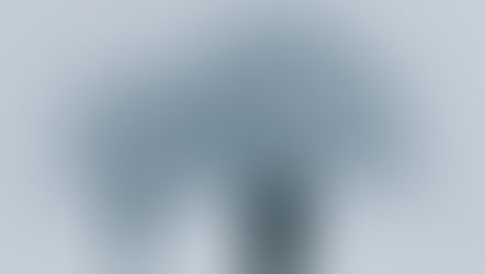 Two people walking through thick fog toward a distant building - representing the journey through grief and disconnection back toward home