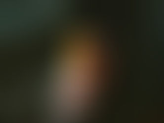 hand holding a small orange