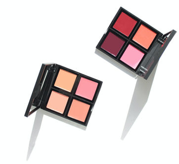 Two open blush palettes with pink and red shades