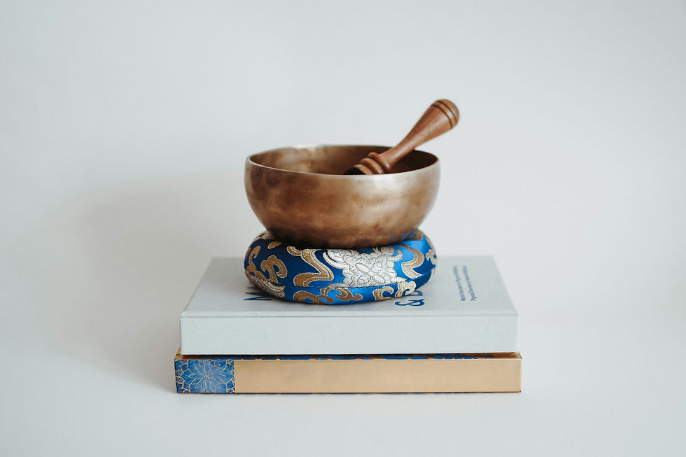 Tibetan bowl on books and cushion