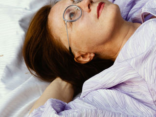 woman lying awake in bed