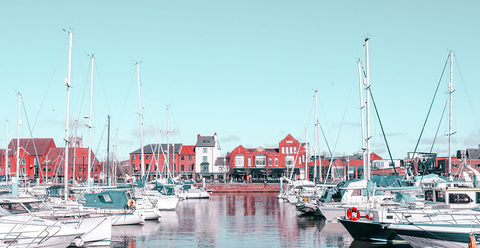 Eye-level view of Aarhus Ø waterfront with modern buildings and water features
