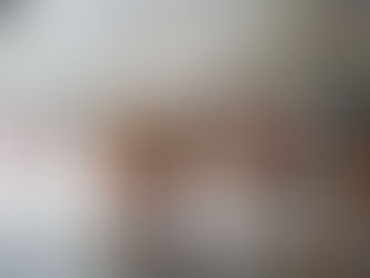 a group of people dressed in ethnic clothing carrying parasols while walking in a parade while it's raining