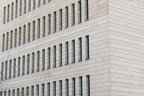 Abstract architecture of stone office building with rectangular windows