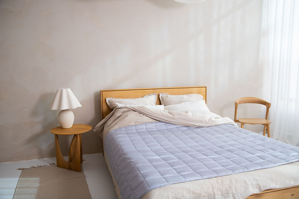 a bed with a blue bedspread in a bedroom