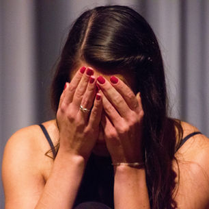 PTSD trauma victim women crying with her head down
