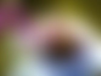 woman with a headache near flowers