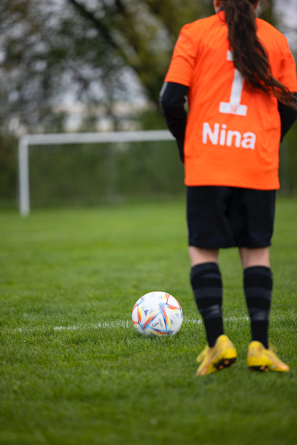 a girl playing a football