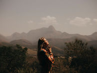 Woman feeling the warmth of the sun on her face