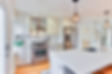 Modern kitchen remodel with white shaker cabinets and quartz countertops in Dayton, Ohio