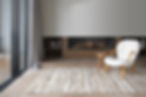 gas fire place in a warm living room with chair