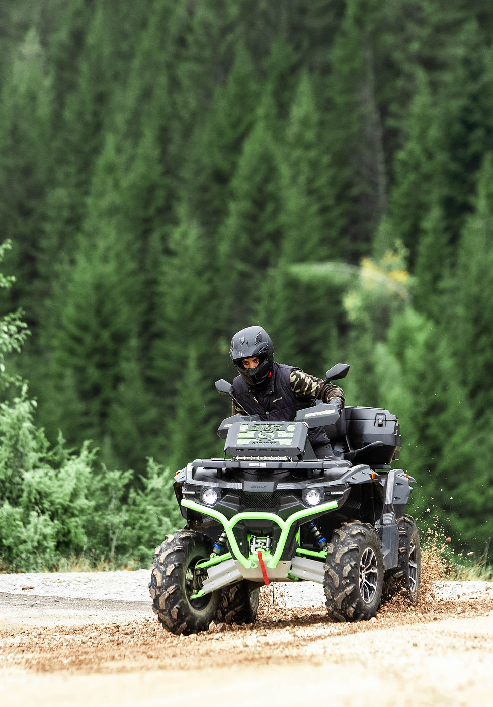 Person on an ATV in a forest