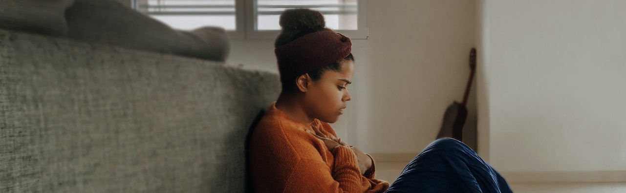 young girl holding chest