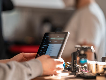 Person using a tablet to review benefits coverage information.