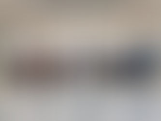 Blurred image of people in line at a TSA checkpoint in an airport