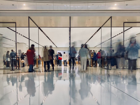 Blurred image of people in line at a TSA checkpoint in an airport