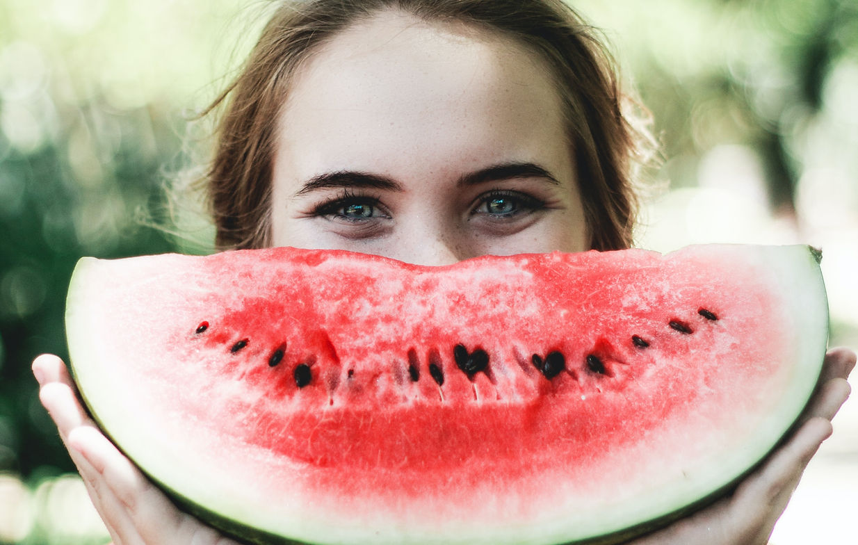 woman with fresh cut watermelon