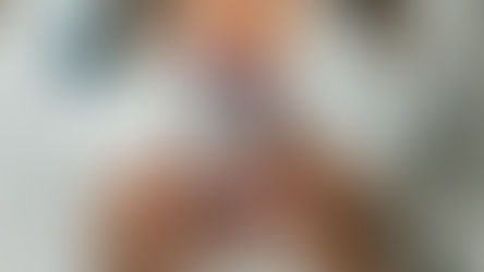 Doctor in a white coat with red nails holding an HTC smartphone and wearing a stethoscope, illustrating smart healthcare technology in a clinical setting.