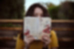 Woman reading a book in a park